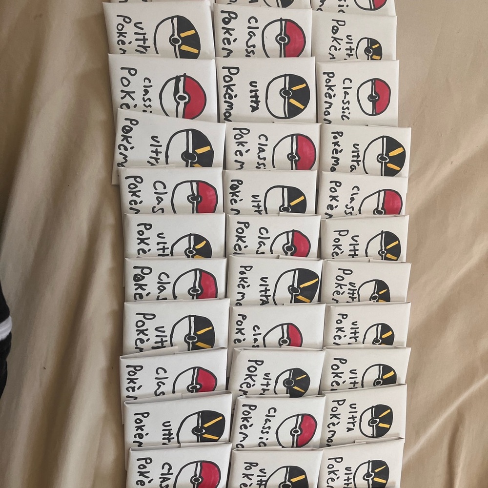 Hand assorted Pokémon packs (11 cards in each pack)